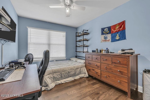 bedroom with ceiling fan and dark wood-style floors