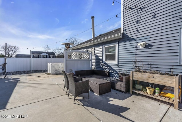 view of patio / terrace with outdoor lounge area and fence