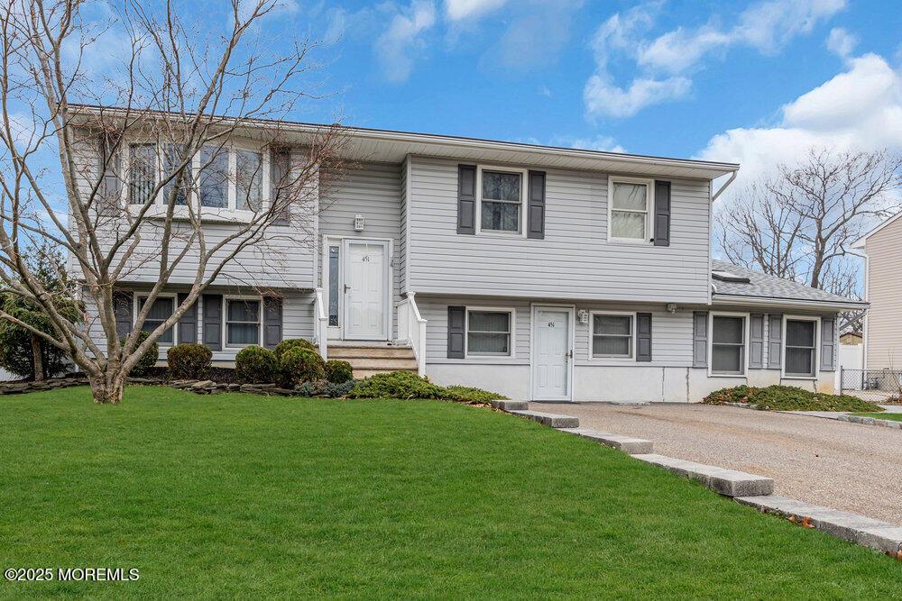 451 16th Ave, Brick, NJ 08724 - bi-level home with a front yard