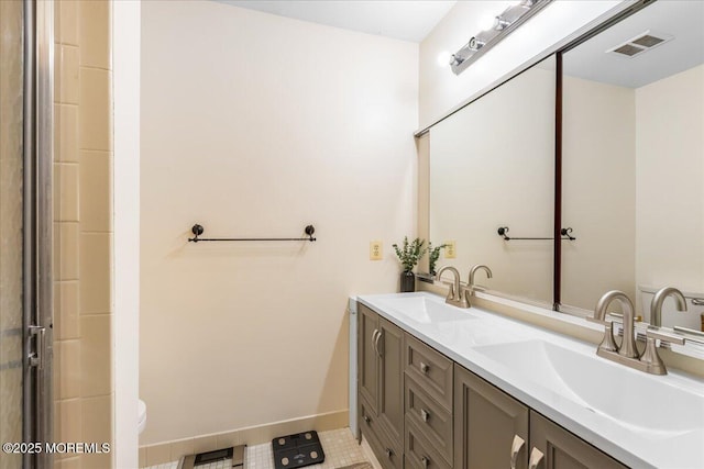 full bathroom with a sink, visible vents, and baseboards