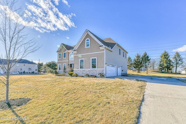 2 Kristen Ct, Franklin Twp, NJ 08873 - view of front of property featuring stucco siding, driveway, a front lawn, stone siding, and a garage