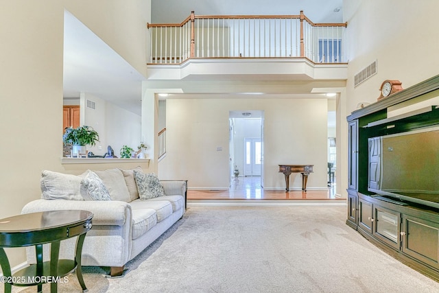2 Kristen Ct, Franklin Twp, NJ 08873 - living room featuring visible vents, carpet, and a towering ceiling