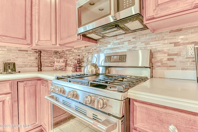 2 Kristen Ct, Franklin Twp, NJ 08873 - kitchen featuring tile patterned floors, light brown cabinetry, appliances with stainless steel finishes, light countertops, and decorative backsplash
