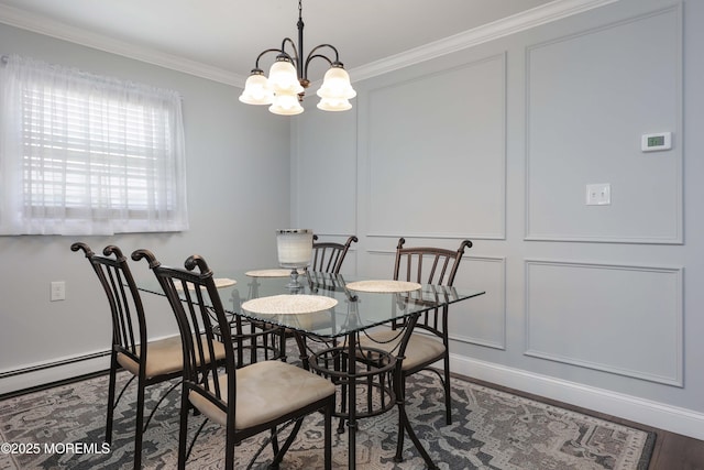 dining room featuring crown molding, a decorative wall, and a notable chandelier