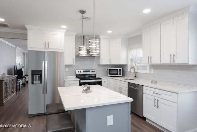 kitchen featuring a sink, stainless steel appliances, visible vents, and wall chimney exhaust hood