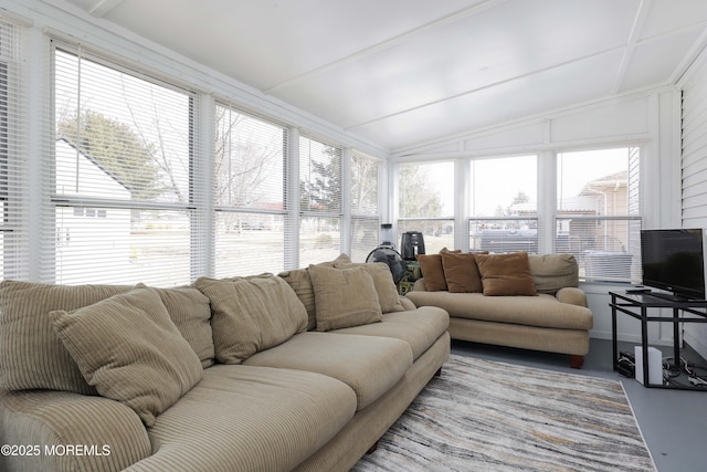 sunroom featuring a wealth of natural light and lofted ceiling