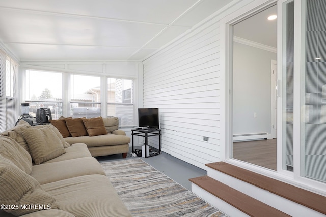 living room featuring baseboard heating, concrete flooring, and crown molding