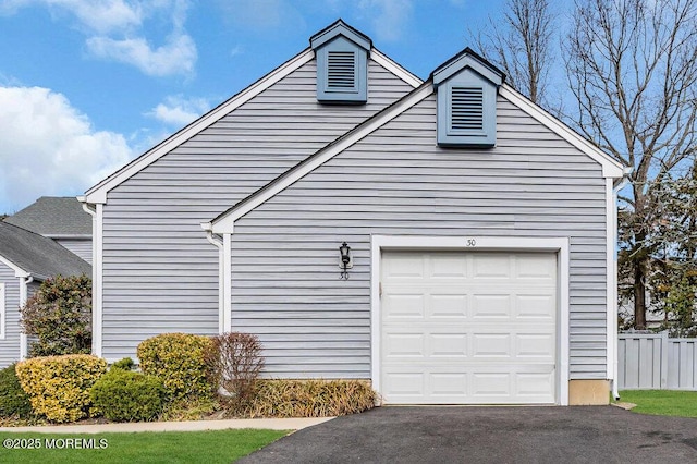 30 Turnberry Cir, Toms River, NJ 08753 - view of side of property featuring aphalt driveway, a garage, and fence
