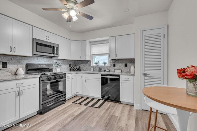 30 Turnberry Cir, Toms River, NJ 08753 - kitchen with light wood-type flooring, black appliances, ceiling fan, and white cabinetry