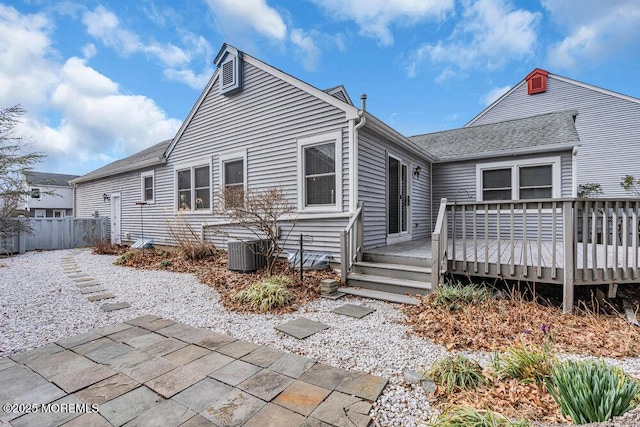 30 Turnberry Cir, Toms River, NJ 08753 - back of property featuring fence, roof with shingles, a wooden deck, central AC, and a patio area