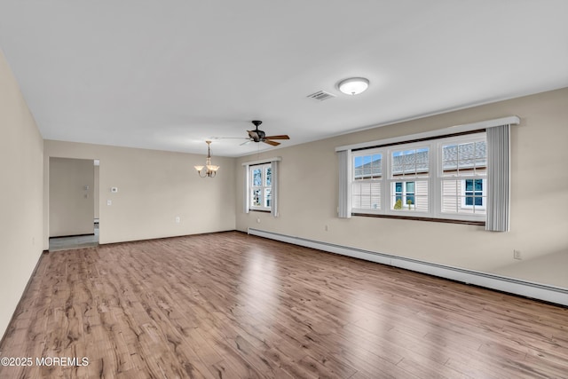 empty room with a baseboard radiator, visible vents, wood finished floors, and ceiling fan with notable chandelier