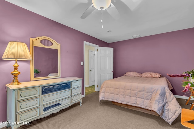 carpeted bedroom featuring visible vents, ceiling fan, and baseboards