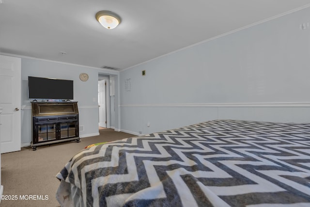 bedroom featuring crown molding, carpet flooring, and visible vents