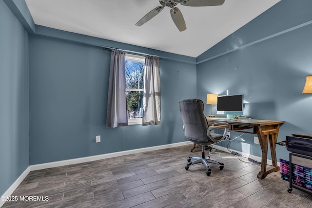 office area featuring wood finish floors, baseboards, a ceiling fan, and vaulted ceiling