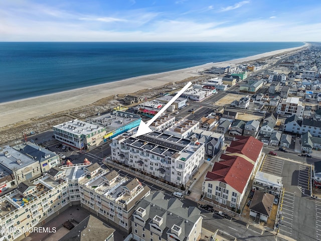 aerial view with a view of the beach and a water view