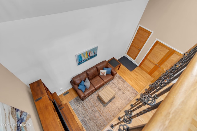 living room with visible vents and wood finished floors