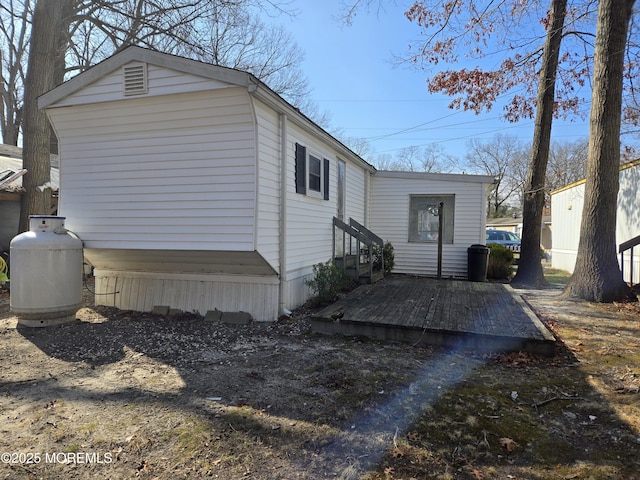 view of side of home with entry steps