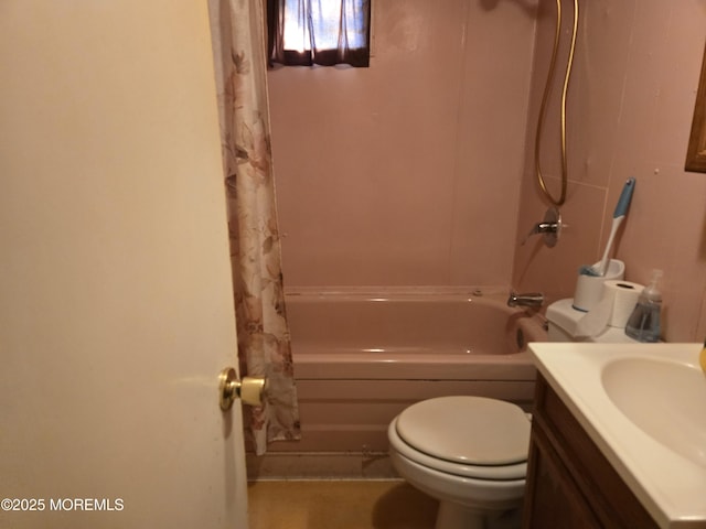 bathroom featuring toilet, shower / bath combo, and vanity