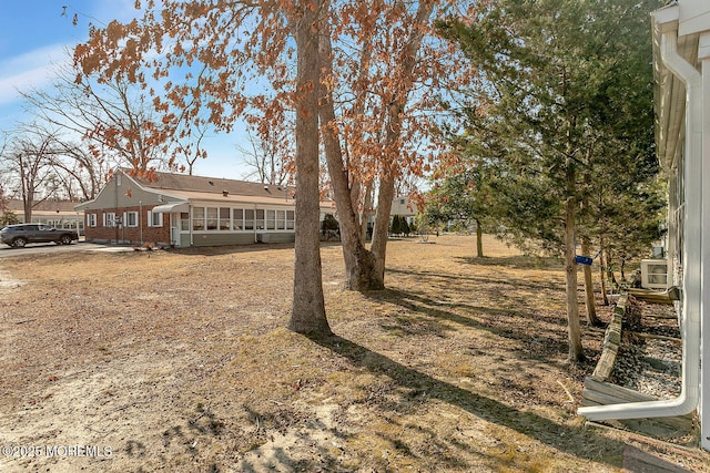 view of yard featuring a sunroom