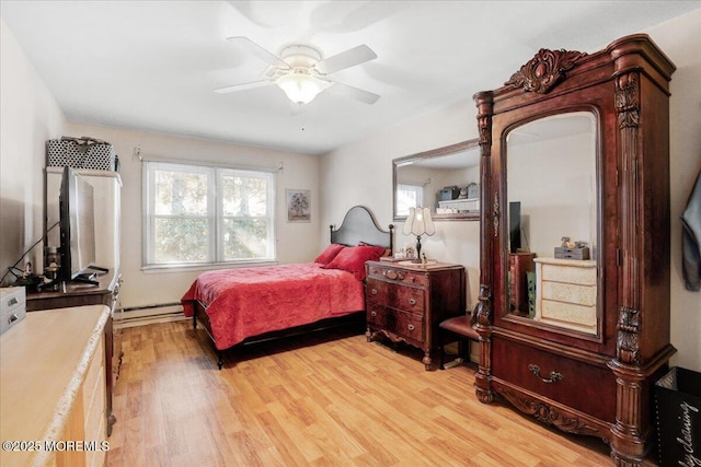 bedroom featuring ceiling fan, light wood finished floors, and a baseboard radiator