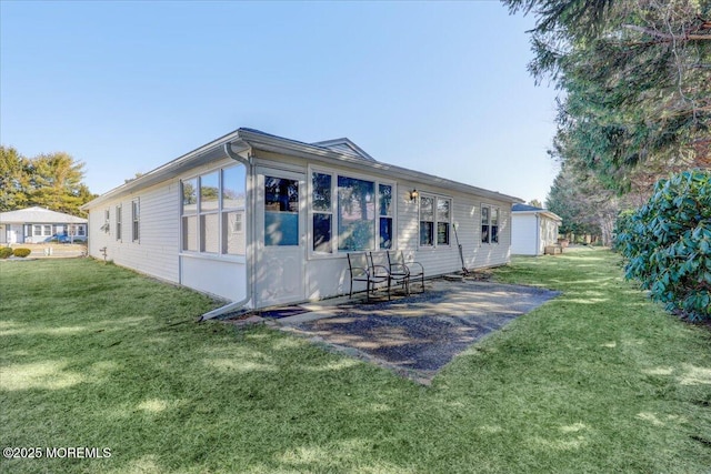 back of house with a yard