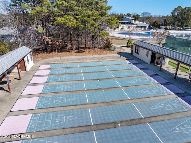 view of pool with shuffleboard