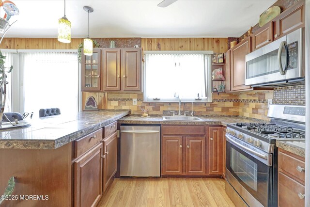 72 Mount Matterhorn Ln, Toms River, NJ 08753 - kitchen with a peninsula, brown cabinets, appliances with stainless steel finishes, and a sink