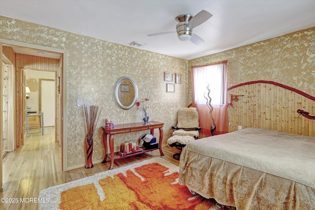 72 Mount Matterhorn Ln, Toms River, NJ 08753 - bedroom with wallpapered walls, wood finished floors, visible vents, and ceiling fan