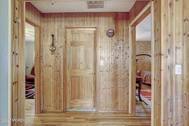 72 Mount Matterhorn Ln, Toms River, NJ 08753 - hall with visible vents, wood walls, and wood-type flooring
