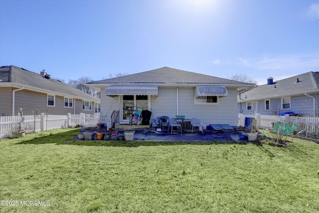 72 Mount Matterhorn Ln, Toms River, NJ 08753 - back of property with a lawn, a fenced backyard, and a shingled roof