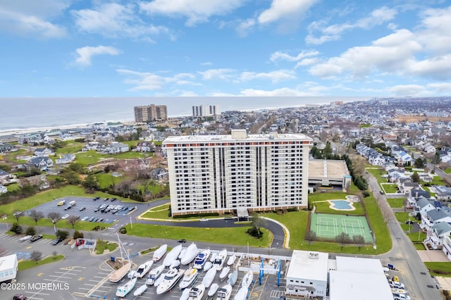 birds eye view of property with a city view and a water view