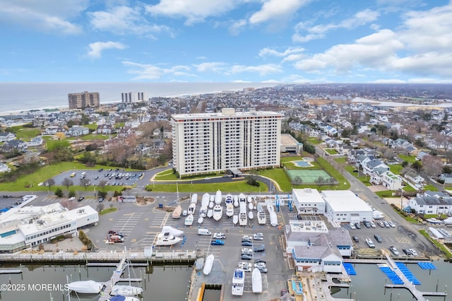 drone / aerial view with a view of city and a water view