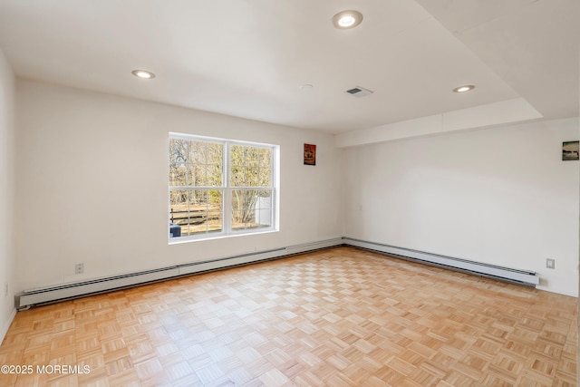 unfurnished room featuring baseboard heating, recessed lighting, and visible vents