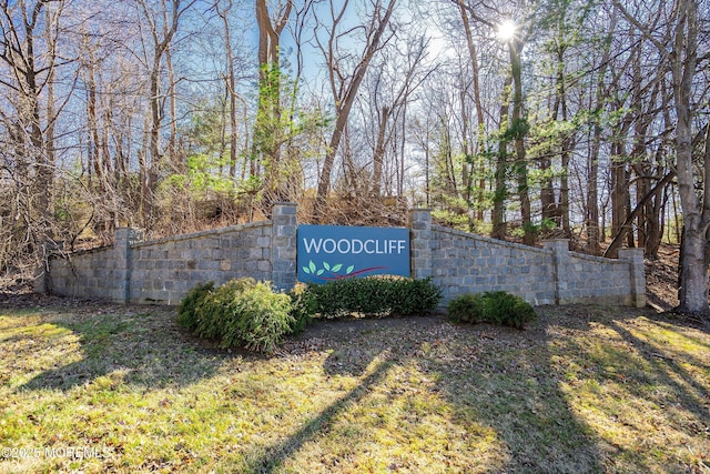 community sign featuring fence