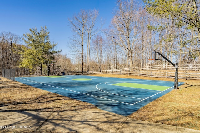 view of sport court featuring community basketball court and fence