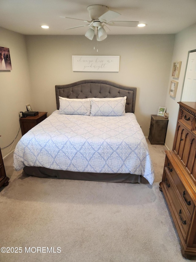 bedroom with recessed lighting, light colored carpet, and ceiling fan