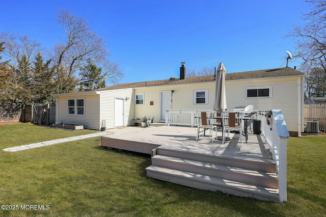 back of house featuring fence, a wooden deck, a yard, a chimney, and central air condition unit