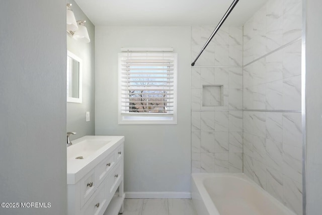 bathroom with vanity, shower / bathtub combination, baseboards, and marble finish floor