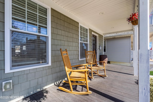 wooden terrace featuring covered porch
