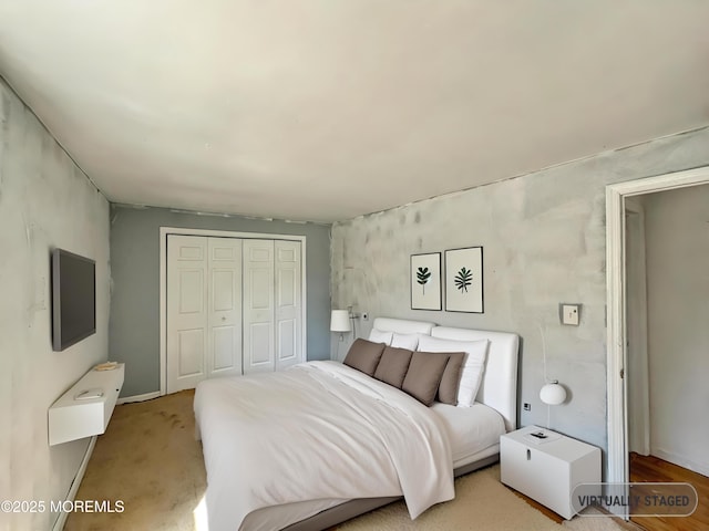 carpeted bedroom with a closet