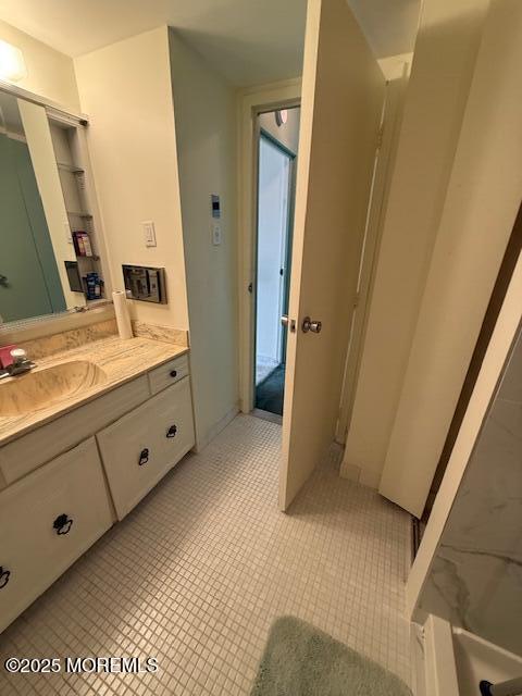 bathroom with vanity and tile patterned flooring