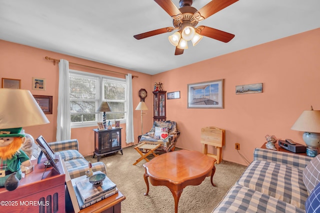 living room with carpet and ceiling fan