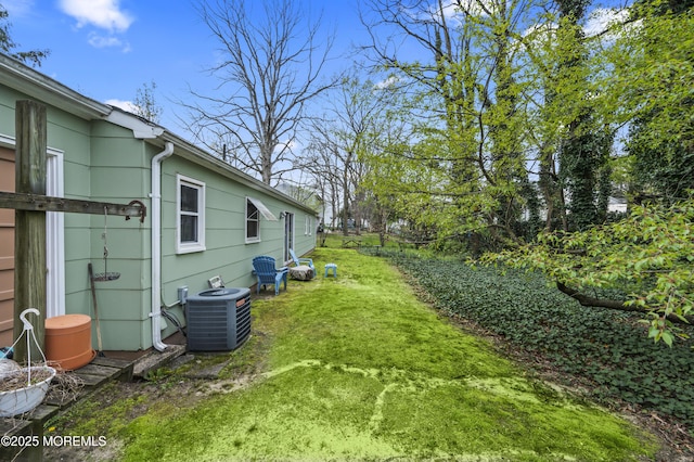 view of yard featuring central AC unit