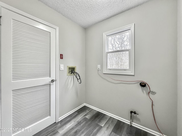 laundry room featuring washer hookup, a textured ceiling, laundry area, baseboards, and dark wood-style flooring