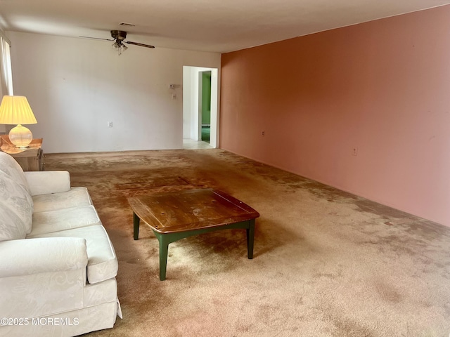 living room featuring visible vents, ceiling fan, and carpet flooring