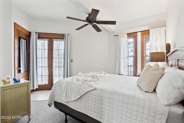 bedroom featuring access to outside, multiple windows, and ceiling fan