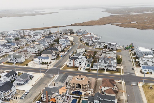 bird's eye view with a residential view and a water view