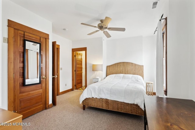 bedroom featuring visible vents, baseboards, a ceiling fan, and carpet flooring