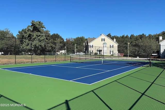 view of sport court featuring community basketball court and fence