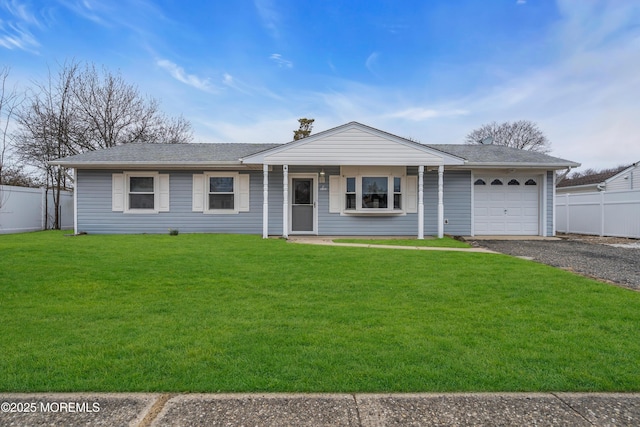 ranch-style house with a garage, driveway, a front yard, and fence